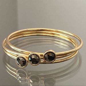 Three LC Gold Bangle Bracelets with Brown Stones